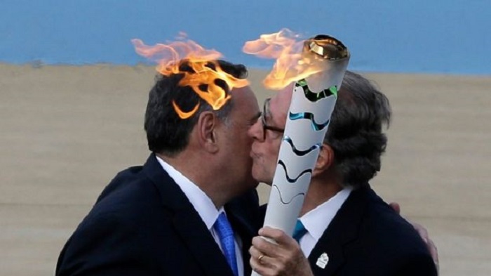 Olympic torch handed over to Brazilians